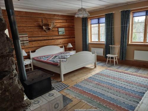 Giường trong phòng chung tại Swedish Paradise Garden & Lake Retreat