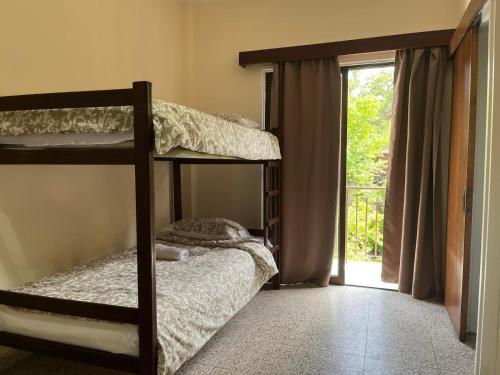 a bedroom with two bunk beds and a sliding glass door at Galata's Bridge Hotel in Galata
