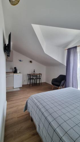 Katil atau katil-katil dalam bilik di Apartmani Ritoša
