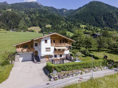 an aerial view of a house with mountains in the background at Apartment with panoramic view in Ramsau