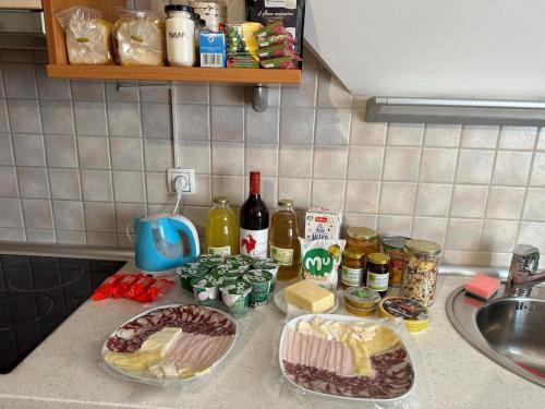 a kitchen counter with food and ingredients on it at ZIDANICA MEDLE in Otočec