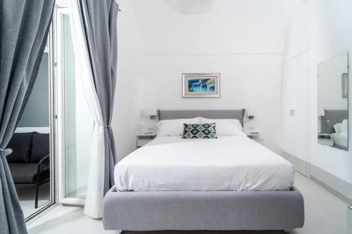 Cama ou camas em um quarto em A 10 Passi