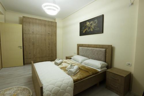 Ένα ή περισσότερα κρεβάτια σε δωμάτιο στο Nov's Apartment2