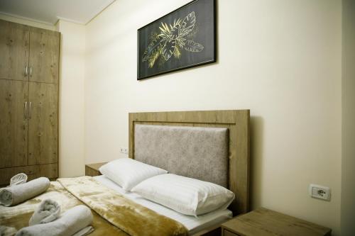 Ένα ή περισσότερα κρεβάτια σε δωμάτιο στο Nov's Apartment2