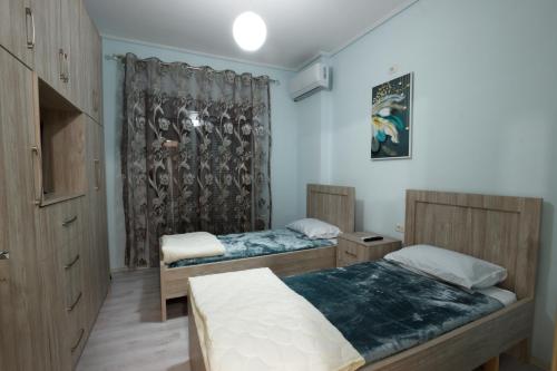 Ένα ή περισσότερα κρεβάτια σε δωμάτιο στο Nov's Apartment2