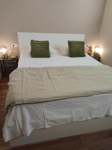 Кровать или кровати в номере Coté cour