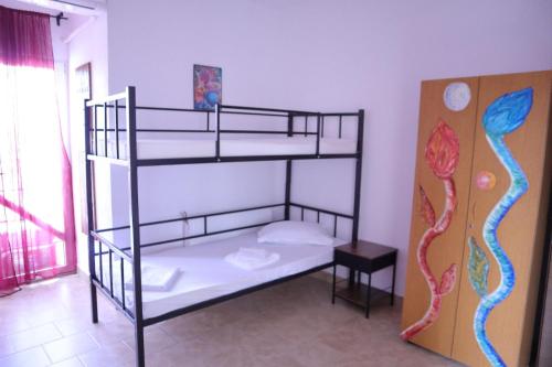 a bedroom with two bunk beds in a room at Taxi Hostel in Otopeni