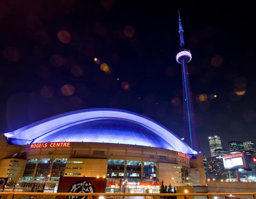 a view of the cn tower at night at InterContinental Toronto Centre by IHG in Toronto