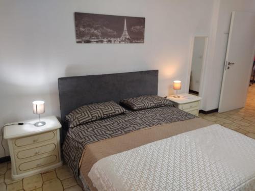 A bed or beds in a room at Vallese Holiday Home Apartment Maiori