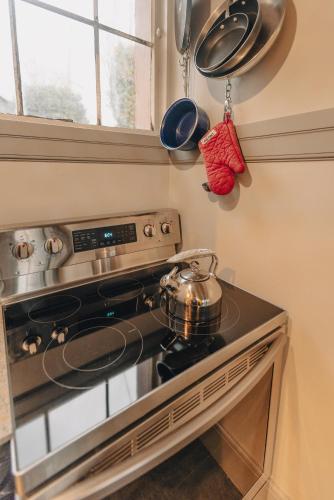 a kitchen with a stove with a pot on it at Luxury Living in Historic Bank Haven of Art&Music in Tomales