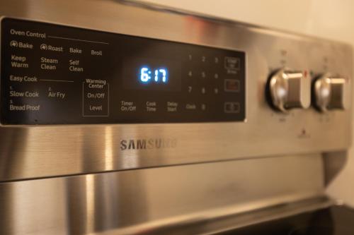 a close up of an oven with a clock on it at Luxury Living in Historic Bank Haven of Art&Music in Tomales