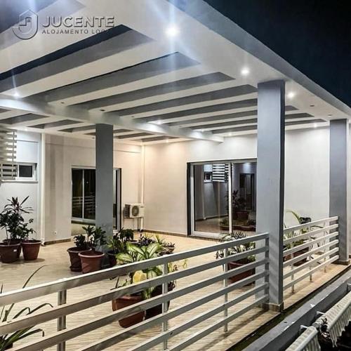 a lobby of a building with a fence and plants at JUCENTE_ALOJAMENTO_LOCAL in Quifica