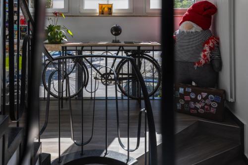 a santa claus doll standing next to a table with a bike at Köln 2020 in Cologne