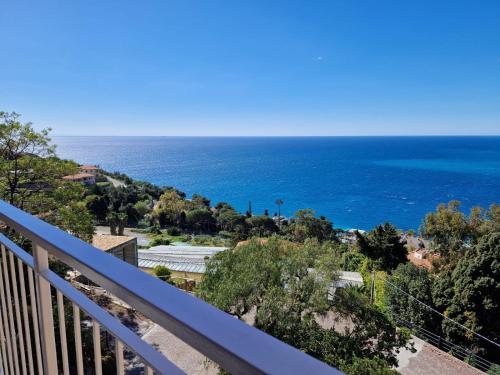a view of the ocean from a balcony at La finestra sul golfo in Ospedaletti