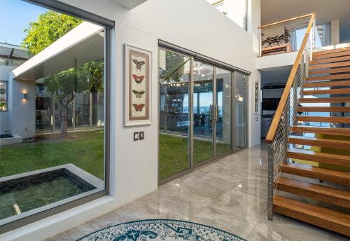 a house with a pool in the middle of a hallway at Benguela Cove - Lavender Dreams in Hermanus