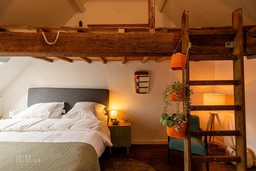 Säng eller sängar i ett rum på Little Antwerp holiday home