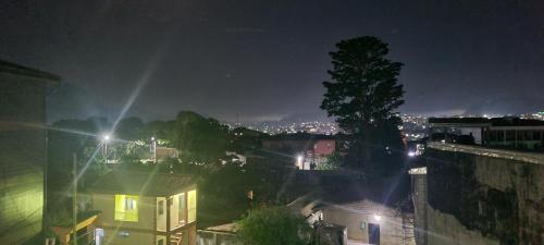 a view of a city at night with lights at RÉSIDENCE 2K Studio Meublé-Chapelle Symbock-Gardien-WIFI-Location Véhicule in Yaoundé