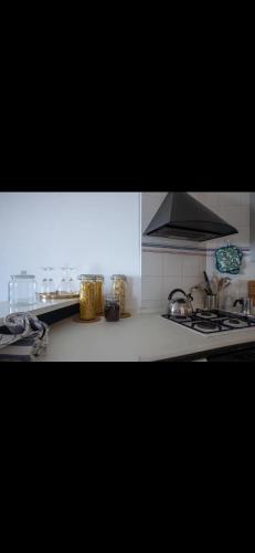 a kitchen with a sink and a stove top oven at Casa Alessia in Positano
