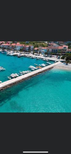 an aerial view of a harbor with boats in the water at Apartmani Potok in Trpanj