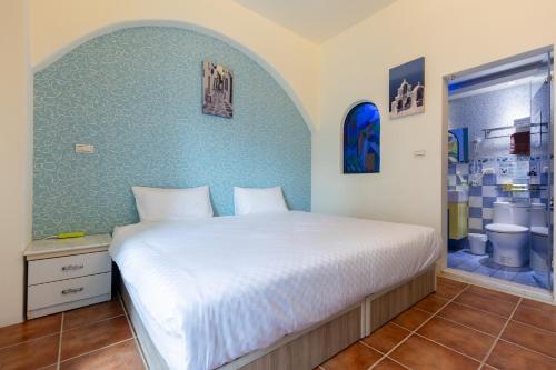 Postel nebo postele na pokoji v ubytování Rainbow B&B