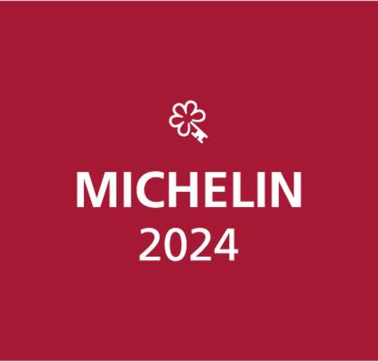 a red box with the words michelin and a flower on it at La Maison du Passage - Chambres - Suites premium, Spa, Piscine et Restaurant in Martignargues