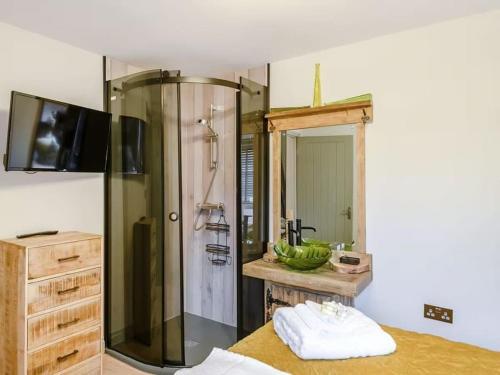 a bathroom with a shower and a sink at Orchard Retreat Staycation in Boston