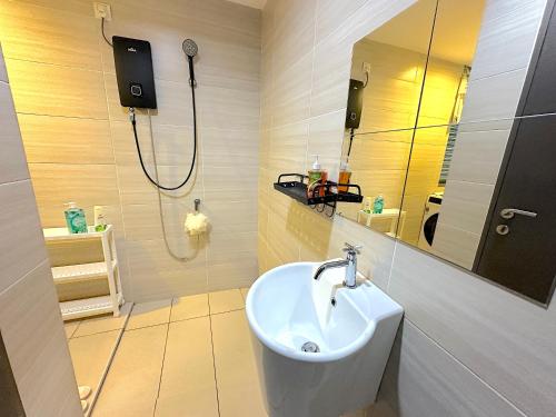 a bathroom with a sink and a shower at 3 Towers Jalan Ampang By Serenity Vacation Homes in Kuala Lumpur