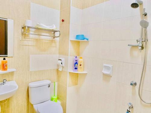 a bathroom with a shower and a toilet and a sink at JB-Bukit Indah 8-15pax Spacious Home! 5min to Aeon in Johor Bahru