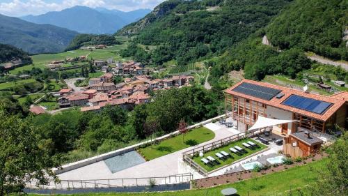 an aerial view of a house in a mountain at ARPA DI PIETRA - Luxury B&B SPA BIO - Adults Only in Mori