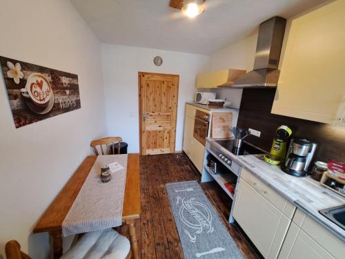 a kitchen with a table and a counter top at Zum Jandel in Boppard