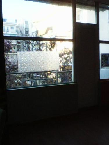 a window in a room with a view of a city at Gene Kelly in Athens