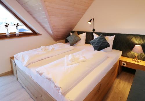 a bedroom with two beds in a attic at Feriendomizil am Rössleberg, Hinterzarten in Hinterzarten