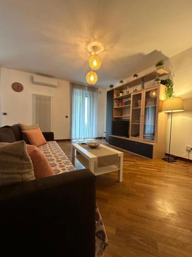 a living room with a couch and a table at La casa di Yasmin_Pescara centro in Pescara