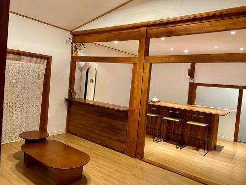 a room with a mirror and a table and a bench at Stay Sayu Hanok in Gyeongju