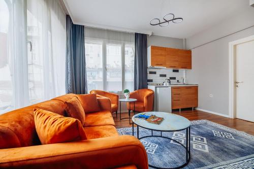 a living room with a couch and a table at Taksim Wonder Suites in Istanbul
