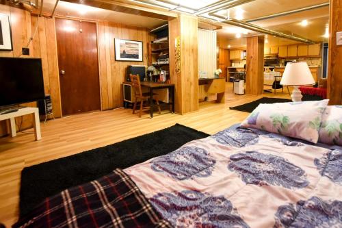 a bedroom with a bed and a living room at Maria Montreal in Montreal