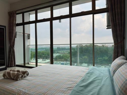 Katil atau katil-katil dalam bilik di Plazio 1 Bedroom & Studio