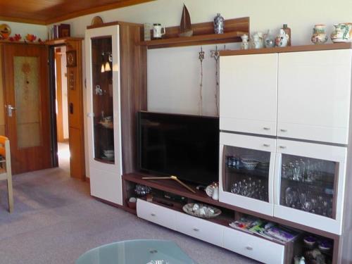 a large white entertainment center with a television in it at Kurhotel Schluchsee - Studio 1208 -mit Hallenbad- Schluchsee in Schluchsee