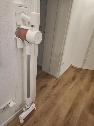 a bathroom with a toilet paper dispenser on the wall at FeWo Planer Altstadtwohnung mit Terrasse & Parkplatz in Memmingen