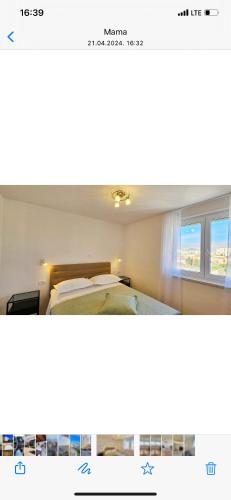 uma fotografia de um quarto com uma cama e uma janela em The view em Split