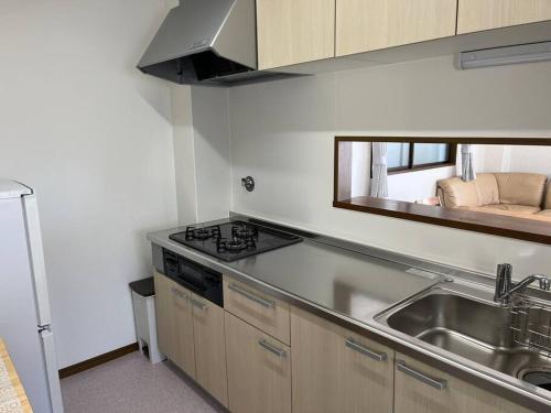 Kuchyň nebo kuchyňský kout v ubytování N's Home-南名古屋駅一軒家ルームシェア-4