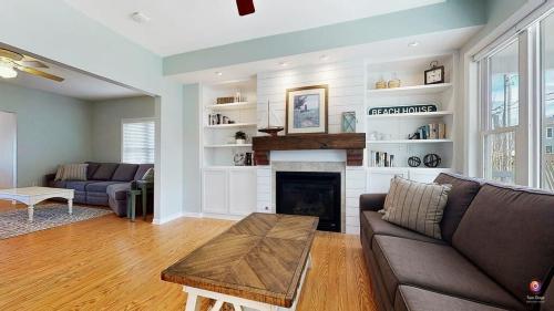 a living room with a couch and a fireplace at Charming Cottage Prime Location 3BR in South Haven
