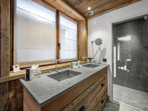 a bathroom with two sinks and a shower at Appartement Val-d'Isère, 5 pièces, 10 personnes - FR-1-567-63 in Val-d'Isère