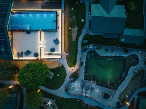 an overhead view of a swimming pool at night at feelfree - Natur & Aktiv Resort Ötztal in Oetz