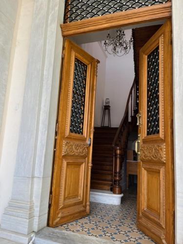 an entrance to a house with a wooden door at 1906 Citygarden in Chios