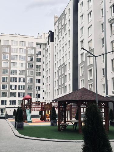 a gazebo in a city with tall buildings at Milescu Residence in Chişinău