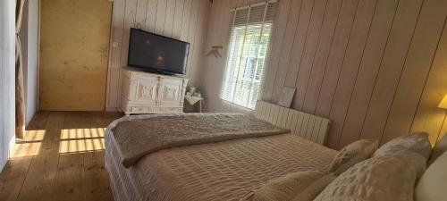 Łóżko lub łóżka w pokoju w obiekcie LaRiviere