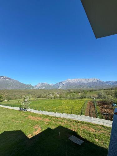 a view of a field with mountains in the background at Villa Morina in Tropojë