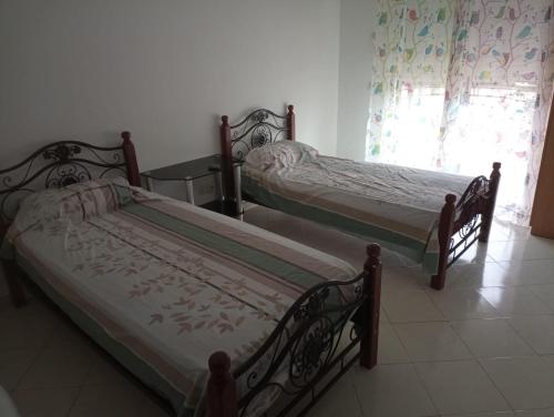 Кровать или кровати в номере Belle appartement