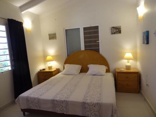 Ένα ή περισσότερα κρεβάτια σε δωμάτιο στο 30 Kas Di Mi Sonjo